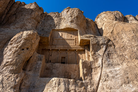 Majestic tombs of Persian kings carved into the hard rock. These ancient tombs are a testament to the grandeur of the Persian Empire, Naqsh-Rostam, Iran.の写真素材