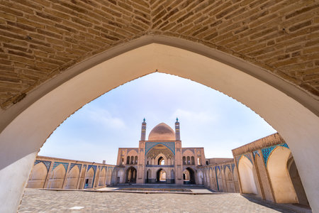Under a clear sky, a stunning arch outlines the Aga Bozog Mosque. The architectural beauty of Tehran, Iran.の写真素材