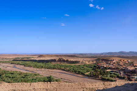 View of Ouarzazate from the Kasbah of Ait Ben Haddou. River dry season.The Berbers built many mud-house Kasbah near the Ait Ben Haddou Gorge, Morocco.の写真素材
