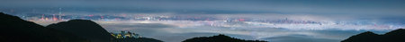 A stunning panoramic view of Taipei City captured from Datun Mountain at night, showing the city...