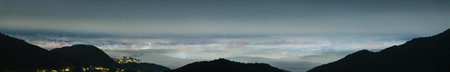 A stunning panoramic view of Taipei City captured from Datun Mountain at night, showing the city...