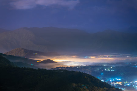 In Yuchi's mountain forest, spring night unveils a mystical blend of glowing lights and drifting...