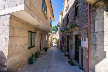 Explore the charming stone architecture and unique cruceiros of Combarro, a traditional Galician...