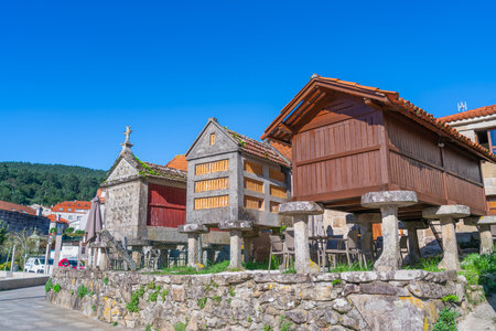 Iconic horreos and traditional architecture in Combarro, a charming Galician village in Pontevedra, Spain. The site dates back to the 12th century and is a symbol of cultural heritage.の写真素材