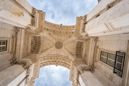 Looking up at elaborate carved stone ceiling of Augusta Street Arch in Lisbon Portugal built to commemorate earthquake reconstruction heritage.の写真素材