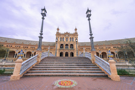 View of a decorative bridge leading to the majestic building at Plaza de Espana in Seville Spain,...