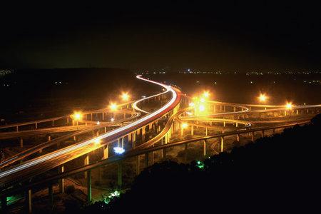 Nighttime traffic light trails at Qing Interchange in Taichung Taiwan, captured in summer 2012,...