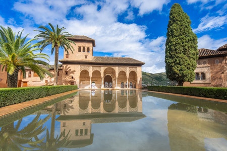 Enjoy the serene Jardines de Partal gardens in La Alhambra Spain, featuring a stunning reflection of...