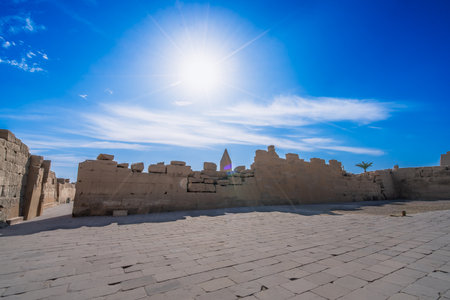 Capture the beauty of a sunrise over Temple of Karnak in Luxor Egypt with ancient ruins and clear blue sky, filmed in 2025.の写真素材