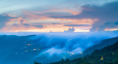 A spectacular summer sunrise over the mountains, with a breathtaking sea of clouds and a vibrant,...