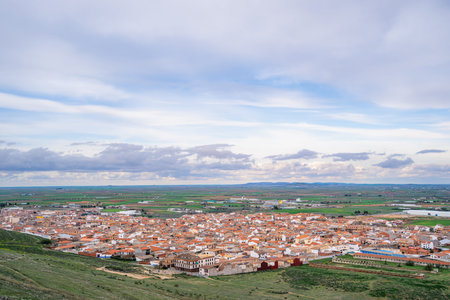Aerial view of the traditional red roof houses in Consuegra, a historic stop on the Don Quixote route under a spring sky in Spain.の写真素材
