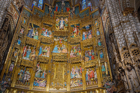 Toledo, Spain - March 14, 2025: The magnificent golden altarpiece or retablo of the Primate Cathedral of Saint Mary of Toledo in Spain.のeditorial素材