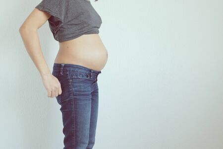 Woman showing pregnant stomachの写真素材