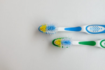 Children's used toothbrush isolated on white background. Time to change concept idea.