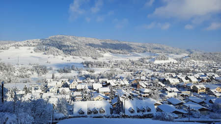 Beauty snowy winter cityscape in Switzerland aerial view. Winter snow covered wallpaper background.の写真素材