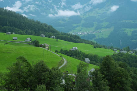 Beautiful alpine pasture villages - Amden in the canton of St. Gallen in Switzerland. Swiss alps landscape view.の写真素材