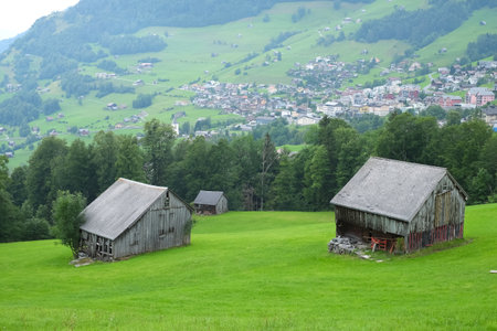 Beautiful alpine pasture villages - Amden in the canton of St. Gallen in Switzerland. Swiss alps landscape view.の写真素材