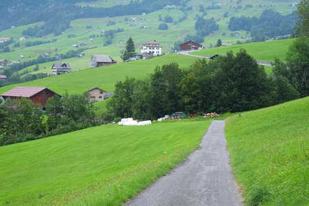 Beautiful alpine pasture villages - Amden in the canton of St. Gallen in Switzerland. Swiss alps landscape view.の写真素材