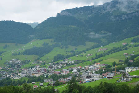 Beautiful alpine pasture villages - Amden in the canton of St. Gallen in Switzerland. Swiss alps landscape view.の写真素材