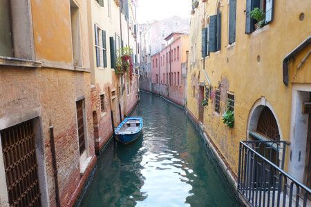 Boat docking in canal beautiful town in Venice, Italy.の写真素材