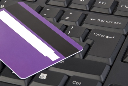 Close-up shot of keyboard and purple credit cardの写真素材