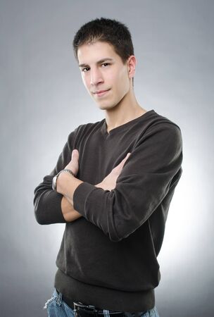 Studio shot of attractive young man with arms foldedの写真素材
