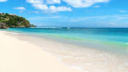 Shoreline on a tropical beach on a beautiful day. Bingin Beach Bali, Indonesia.の写真素材