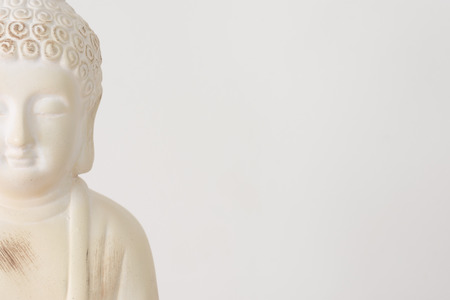 Buddha ornament on white background with copy space for text.の写真素材