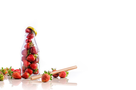 delicious strawberries in glass isolated on white background with small reflection.の写真素材