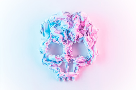 Scrunched paper colorful abstract Skull on white background.の写真素材