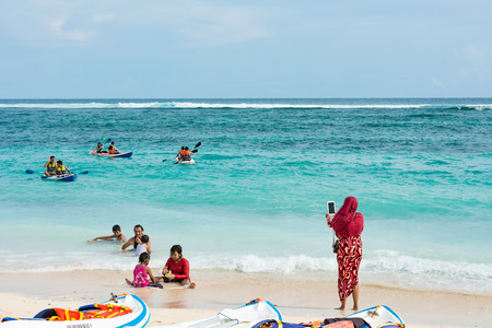28 December 2017 - Bali, Indonesia : People enjoying themselves at Pandawa beach in Bali.のeditorial素材