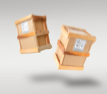 Fragile boxes free falling through the air - logistics & e-commerce delivery/ packaging concept image.の写真素材