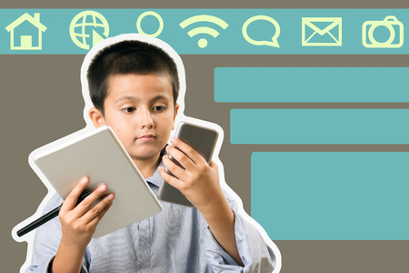 Boy wearing his fathers collared shirt pretending to be business man with phone and tablet. Childsplay, modern learning and technology concept image with copy space added for text.の写真素材
