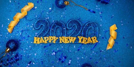 Sparkling new years 2020 3d letters with confetti and christmas bulbs - new years holiday concept...
