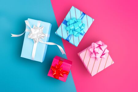 Wrapped gifts with blue and pink background  - Holiday  celebrations and life events concept photo with copy space for textの写真素材
