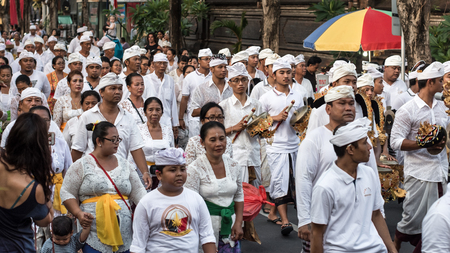 Seminyak Bali, Indonesia - 08 march 2016 : Balinese Hindu people peforming ritual ceremony in the street on the eve of Nympiのeditorial素材