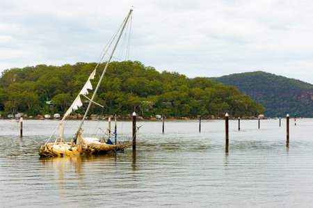 Sunken yacht on the hawksbury river in a rural area of North Sydney, Australia.の写真素材