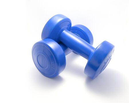 1 kilogram Exercise Dumbbells Crossed and Isolated on a White Backgroundの写真素材