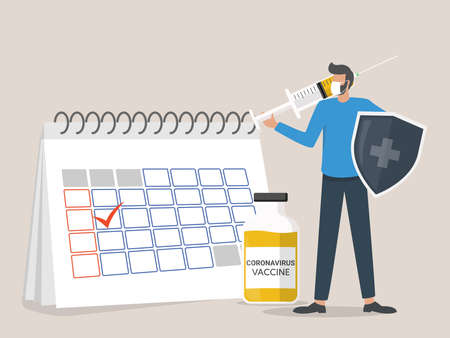 man wearing a face mask standing next to the calendar holds a shield and injects the coronavirus vaccine, time to vaccinate conceptのイラスト素材