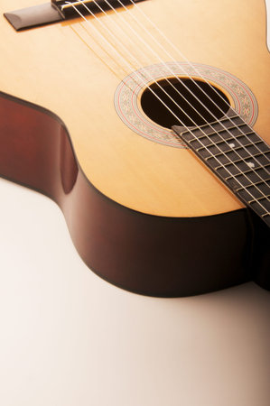 Studio detail photograph of an acoustic spanish classical guitar