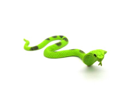 Close up of cobra snake toy isolated on white background.の写真素材
