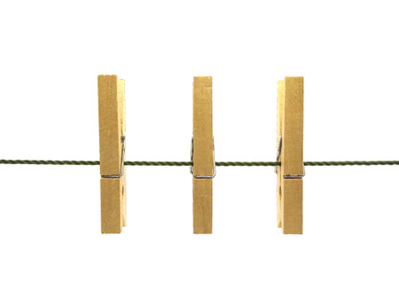 Wooden clothes pins on green rope isolated on white background.