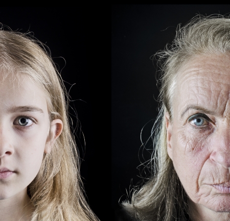 Grandmother and granddaughter closeup faces looking in the cameraの写真素材