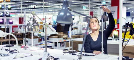 Woman shopping for indoor lightingの写真素材