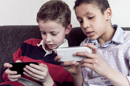 Kids gaming on smartphone