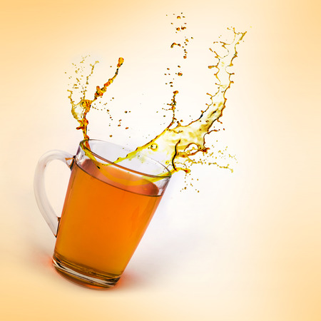 tea can with splashの写真素材