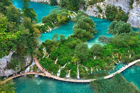 PLITVICE, CROATIA - JULY 29: Tourist enjoy sightseeing the lakes and wonderful landscapes at the Plitvice natural Park in Croatia during the summer holidays, on July 29th, 2016 in Plitvice, Croatiaのeditorial素材