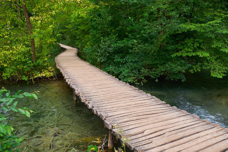 Wooden Road Trail in Plitvice National Park Croatia with Water Streamの写真素材
