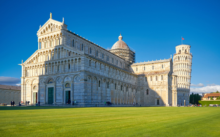 ITALY, PISA, PIAZZA DEI MIRACOLI - 02 MAY 2017. Tourists relaxing on the Grass next to the Leaning Tower of Pissa.のeditorial素材
