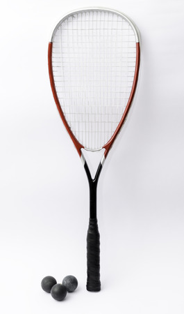 Squash racket isolated on white with ballsの写真素材